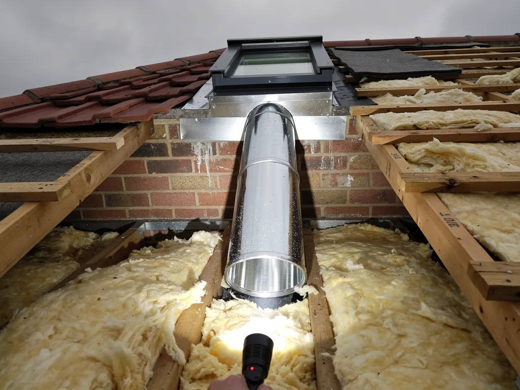 A rigid sun tunnel tube running through a loft