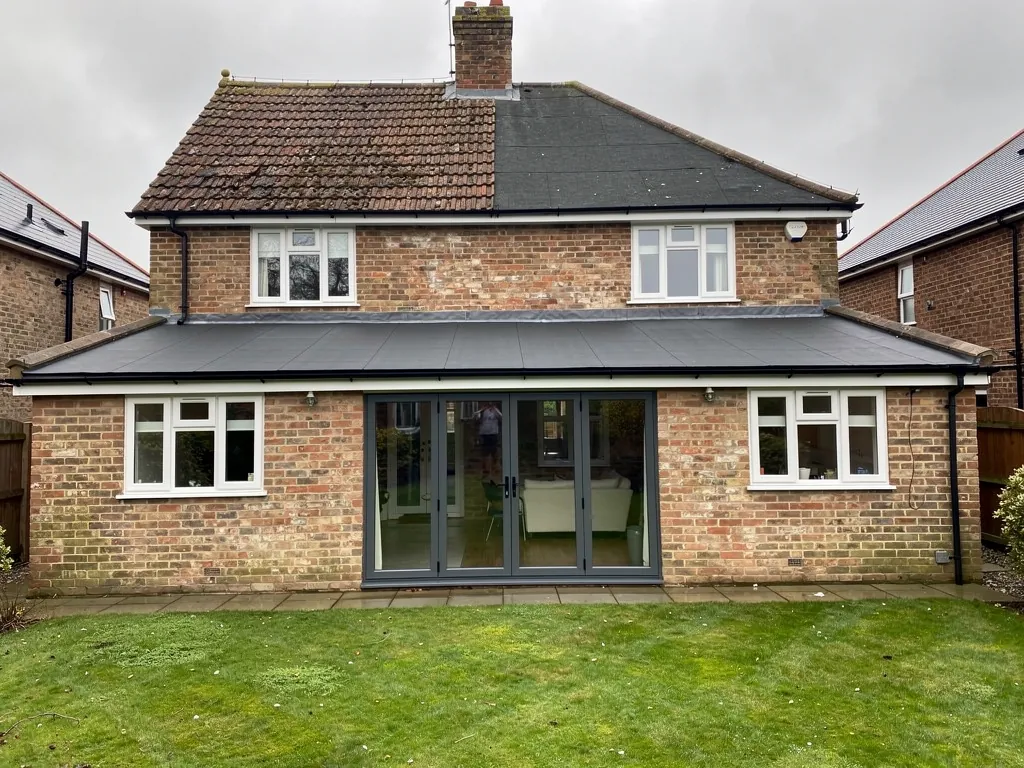 A rear flat-roof kitchen extension on a 1950s semi